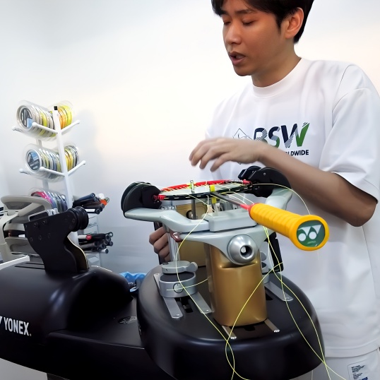 Advanced racket stringing technique demonstration using Yonex ProTech machine with precision string tension control