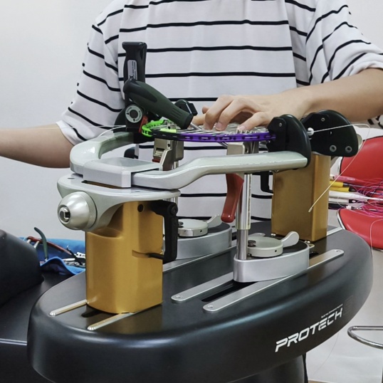 Professional badminton racquet stringing certification - Students practicing premium string installation techniques at Hong Kong training center