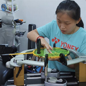 14-year-old Leow Yee Peng learning professional racquet stringing techniques at BSW certification course in Langkawi