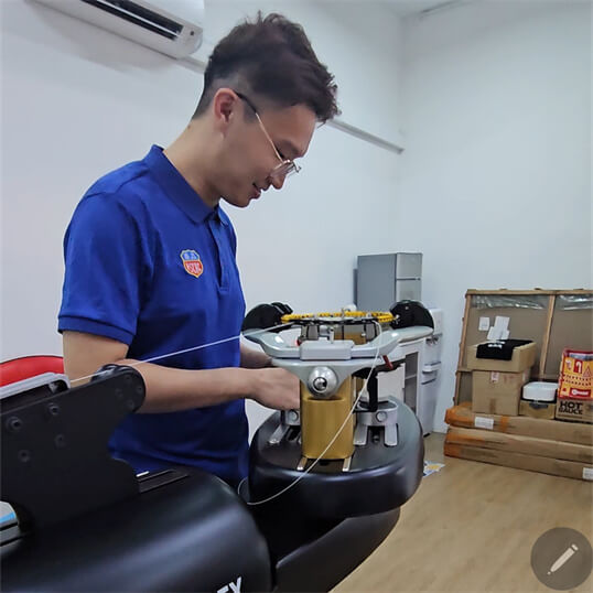 Hands-on racquet frame preparation training for Ricky Chen at BSW stringing certification