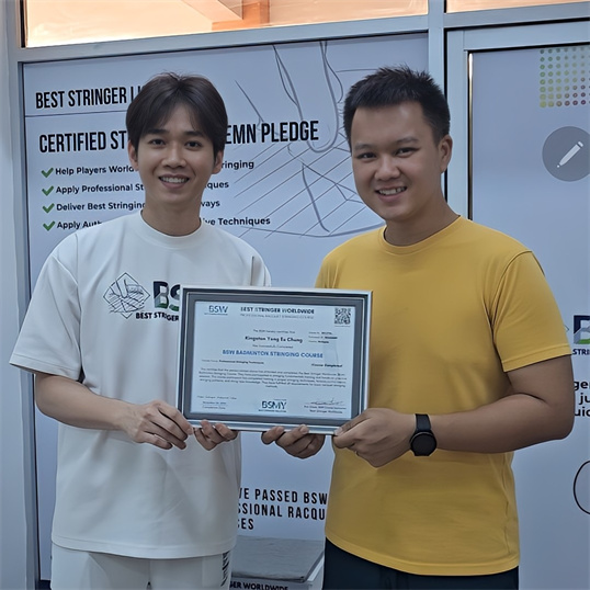 Student receiving BSW badminton stringing certification award