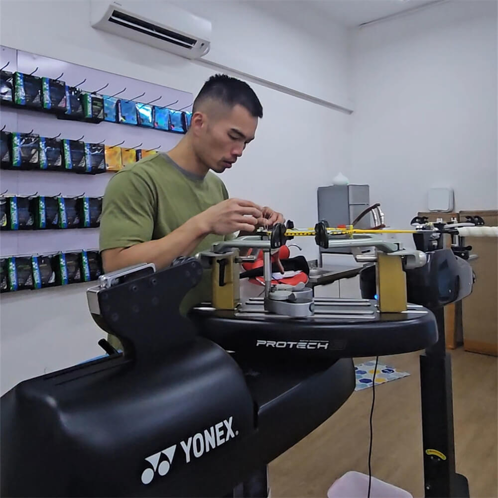 Chin-Teng Lin (Gary) learning badminton stringing patterns during BSW training