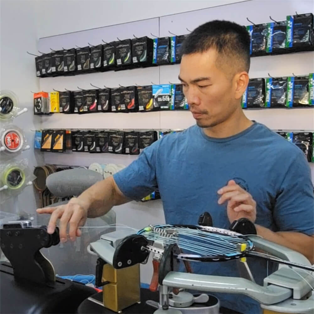 Chin-Teng Lin (Gary) using electronic stringing machine during BSW professional stringer workshop BSAU