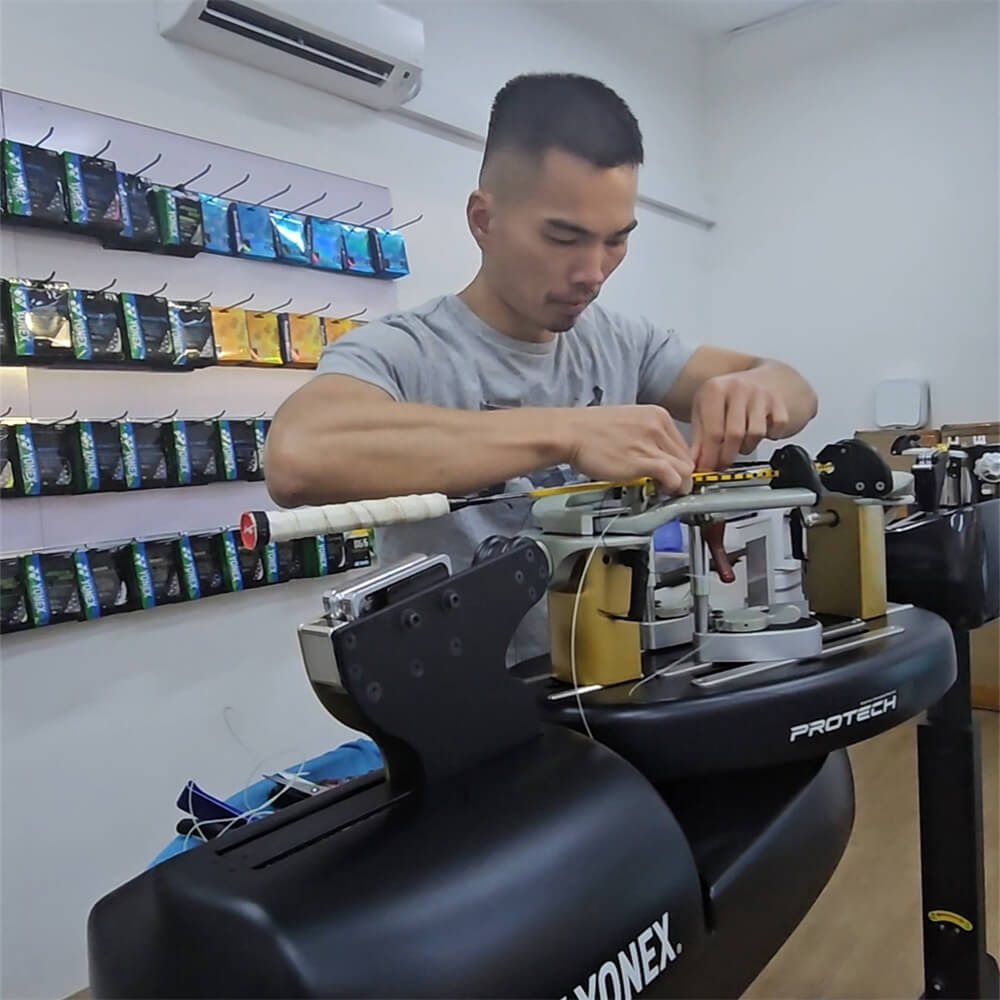 Chin-Teng Lin (Gary) using electronic stringing machine during BSW professional stringer workshop