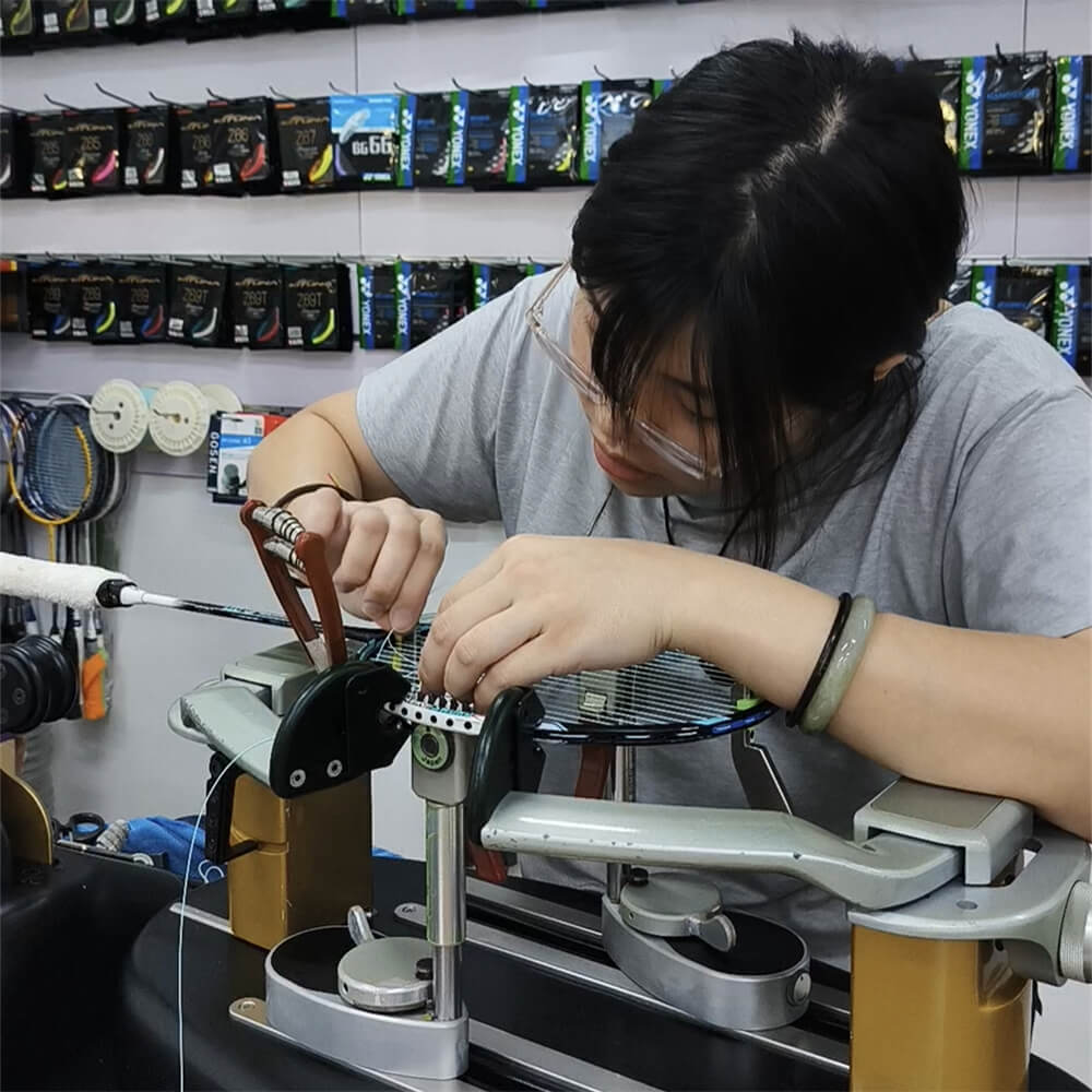 Elise Leong studying badminton stringing theory at BSW class