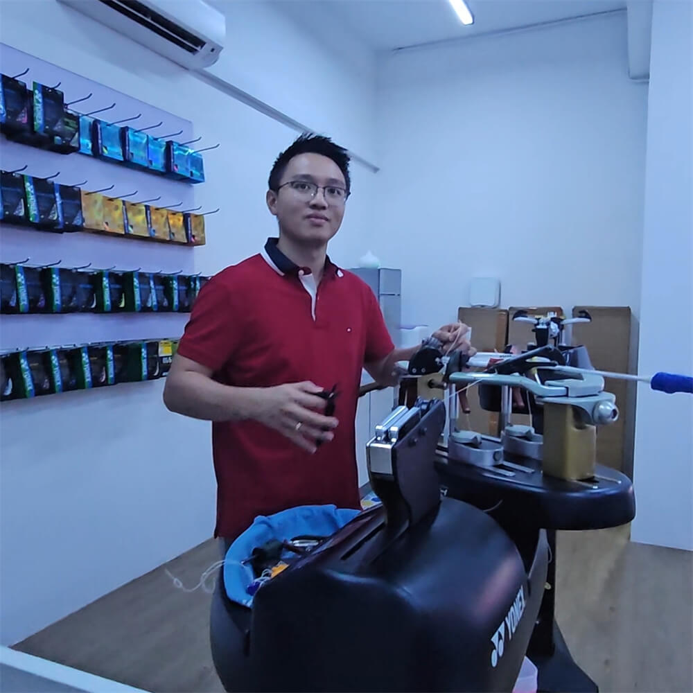 Jimmy Johanes Tjandra learning badminton stringing patterns during BSW training