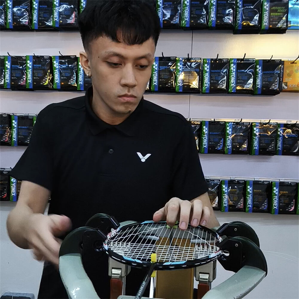 Lee Then Jay mastering badminton stringing techniques at BSW course in Puchong Lee Then Jay mastering badminton stringing techniques at BSW course in Puchong