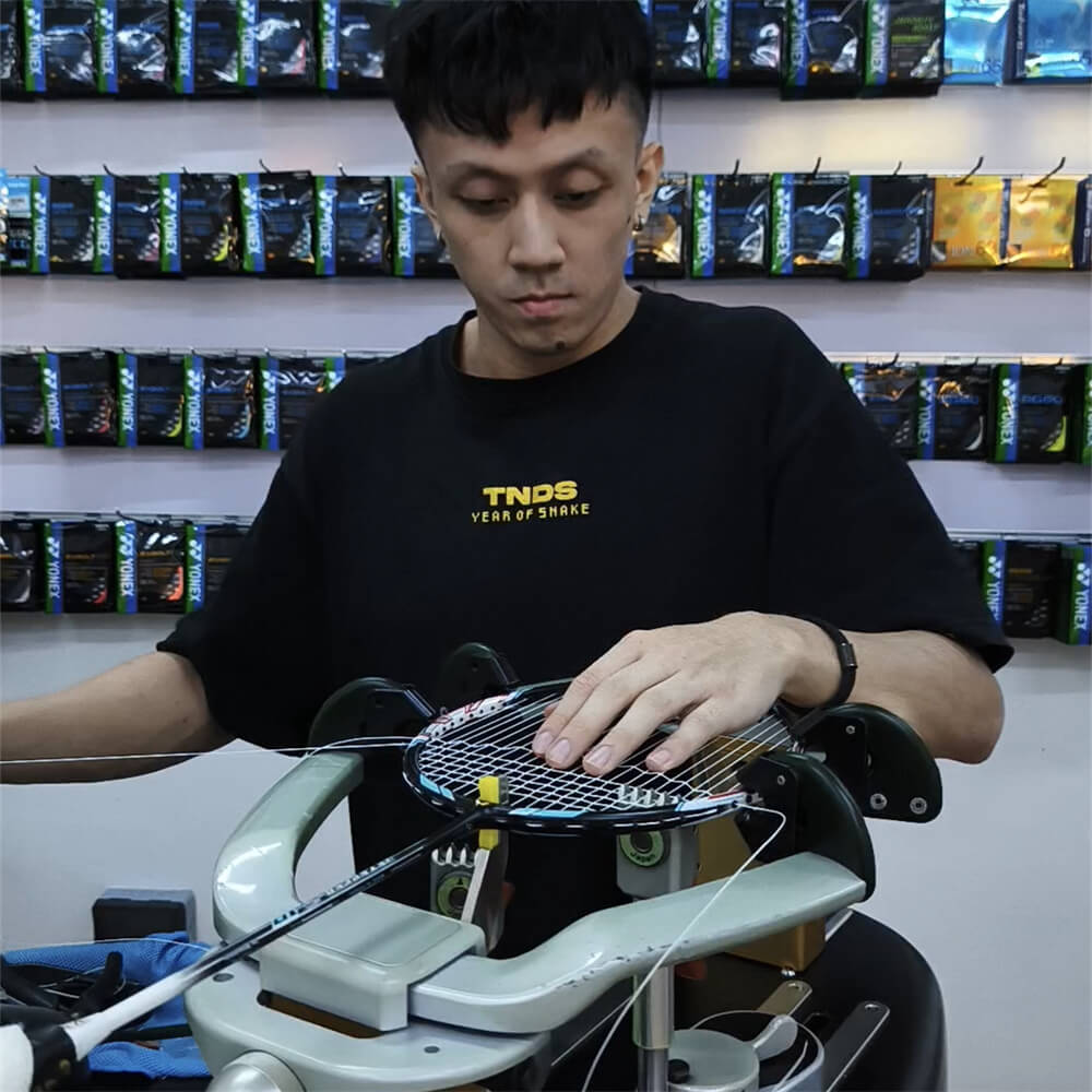 Lee Then Jay mastering badminton stringing techniques at BSW course in Selangor Lee Then Jay mastering badminton stringing techniques at BSW course in Selangor