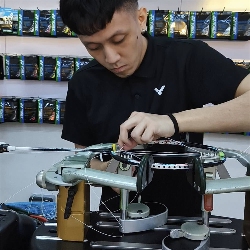 Lee Then Jay studying badminton stringing theory at BSW class Lee Then Jay studying badminton stringing theory at BSW class