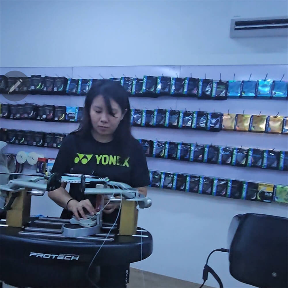 Lim Mei Wern studying badminton stringing theory at BSW class