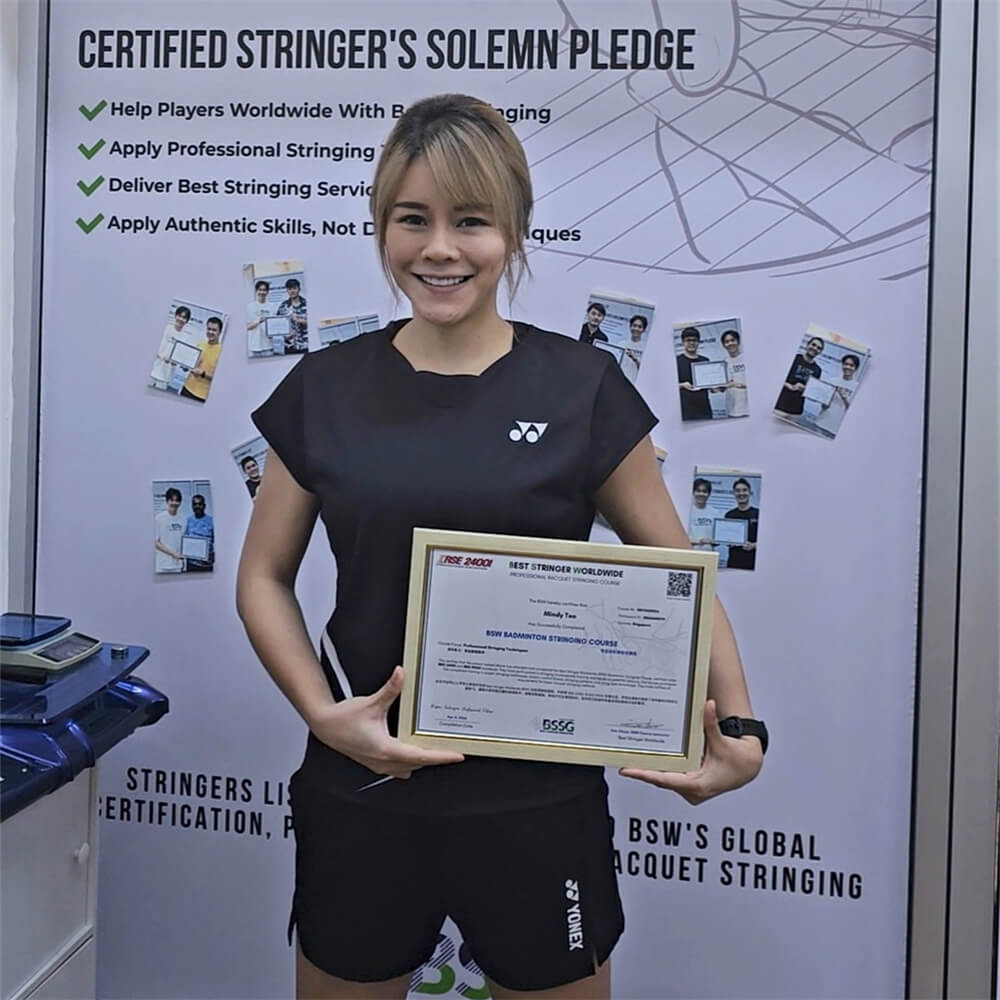 Mindy Teo receiving BSW badminton stringing course certification photo Mindy Teo receiving BSW badminton stringing course certification photo