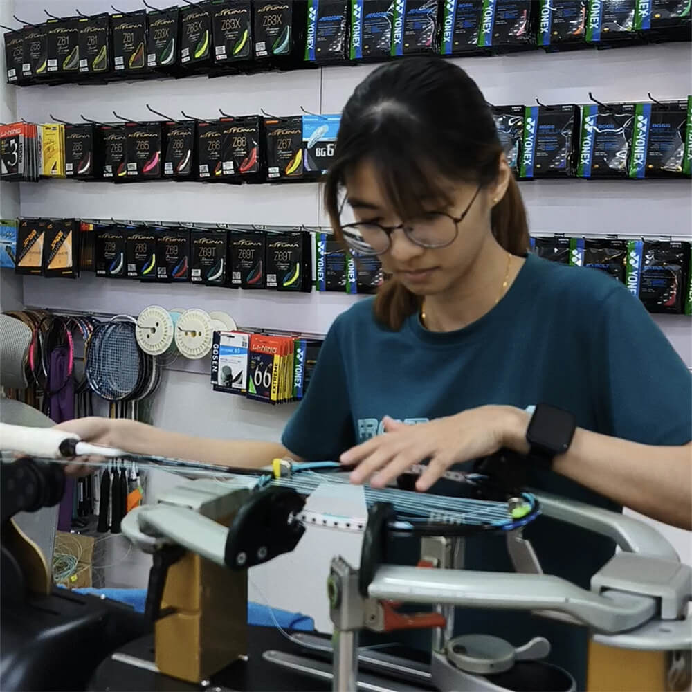 Ngan Xien Hwee learning badminton stringing patterns during BSW training Ngan Xien Hwee learning badminton stringing patterns during BSW training