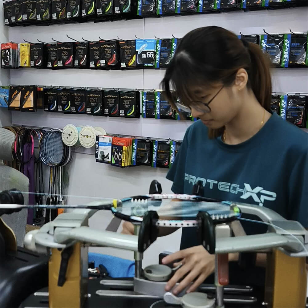 Ngan Xien Hwee mastering badminton stringing techniques at BSW course in Ayer Hitam Ngan Xien Hwee mastering badminton stringing techniques at BSW course in Ayer Hitam