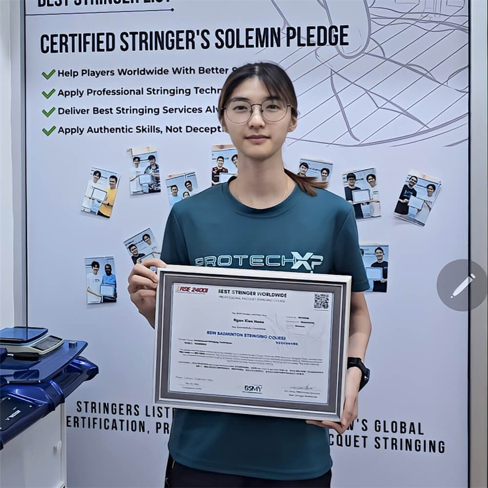 Ngan Xien Hwee receiving BSW badminton stringing course certification photo Ngan Xien Hwee receiving BSW badminton stringing course certification photo
