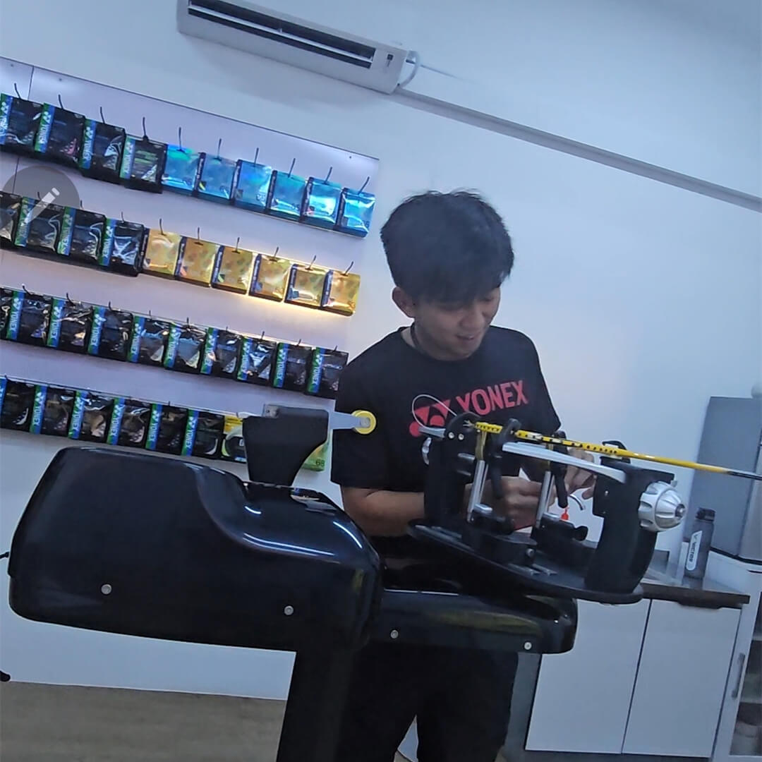 Raymond Tan receiving BSW badminton stringing course certification photo Raymond Tan receiving BSW badminton stringing course certification photo