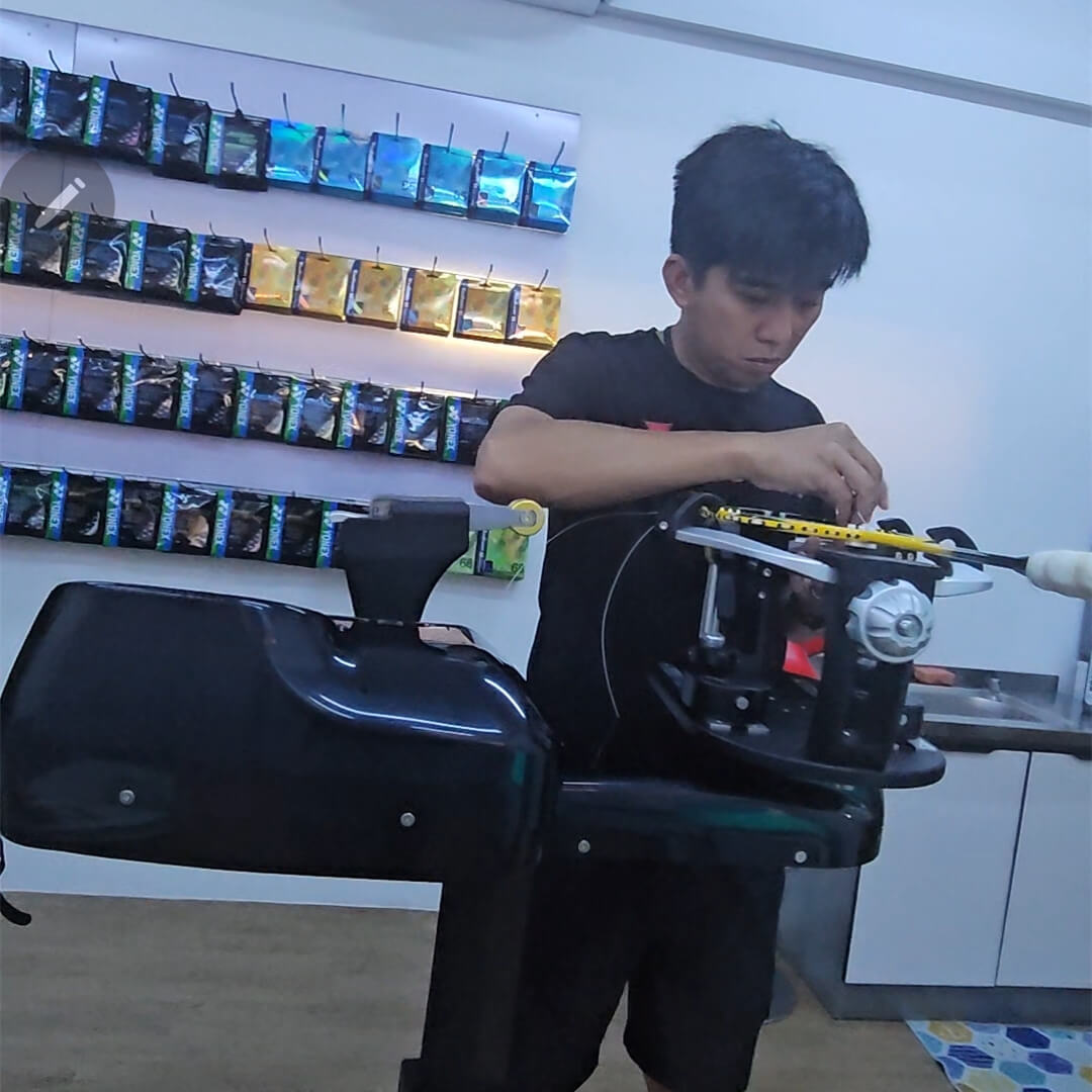 Raymond Tan studying badminton stringing theory at BSW class Raymond Tan studying badminton stringing theory at BSW class