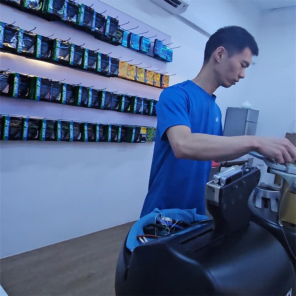 Roger Lin mastering badminton stringing techniques at BSW course in Singapore