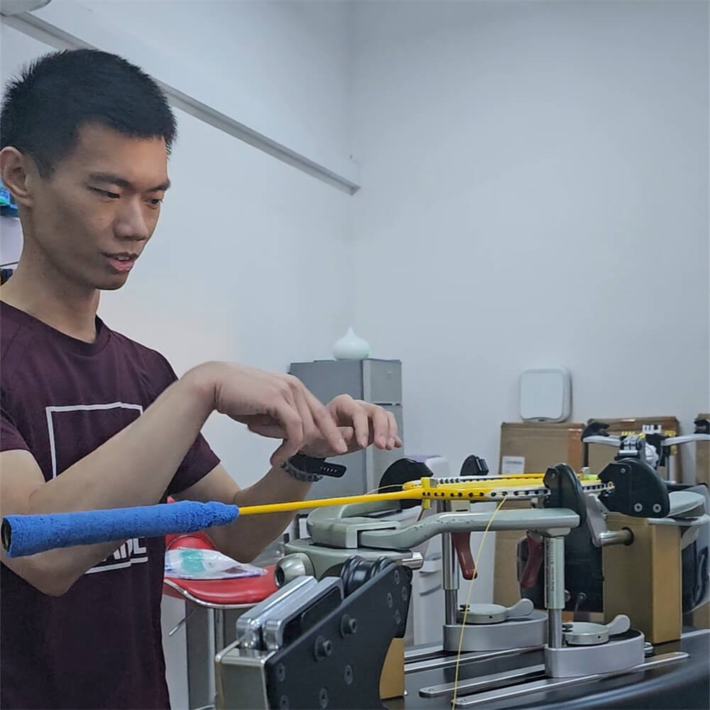 Roger Lin receiving BSW badminton stringing course certification photo