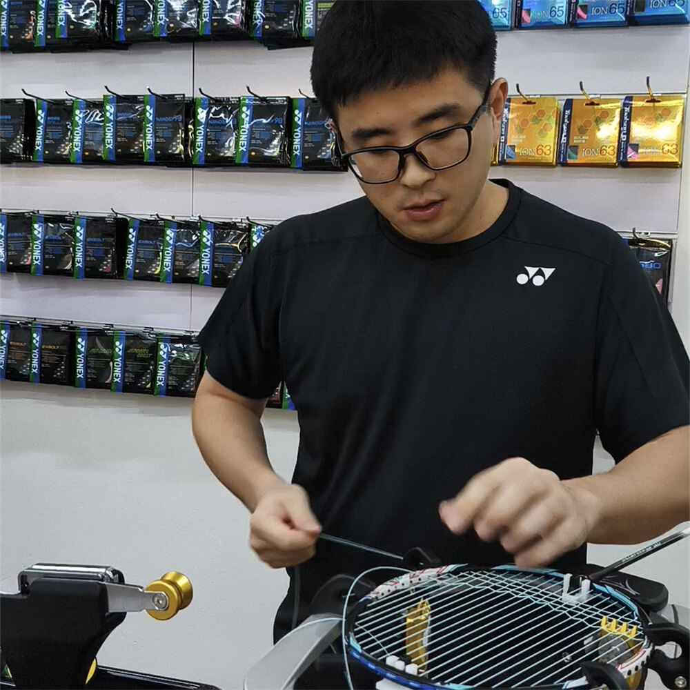 Wincent Chuah mastering badminton stringing techniques at BSW course in Singapore