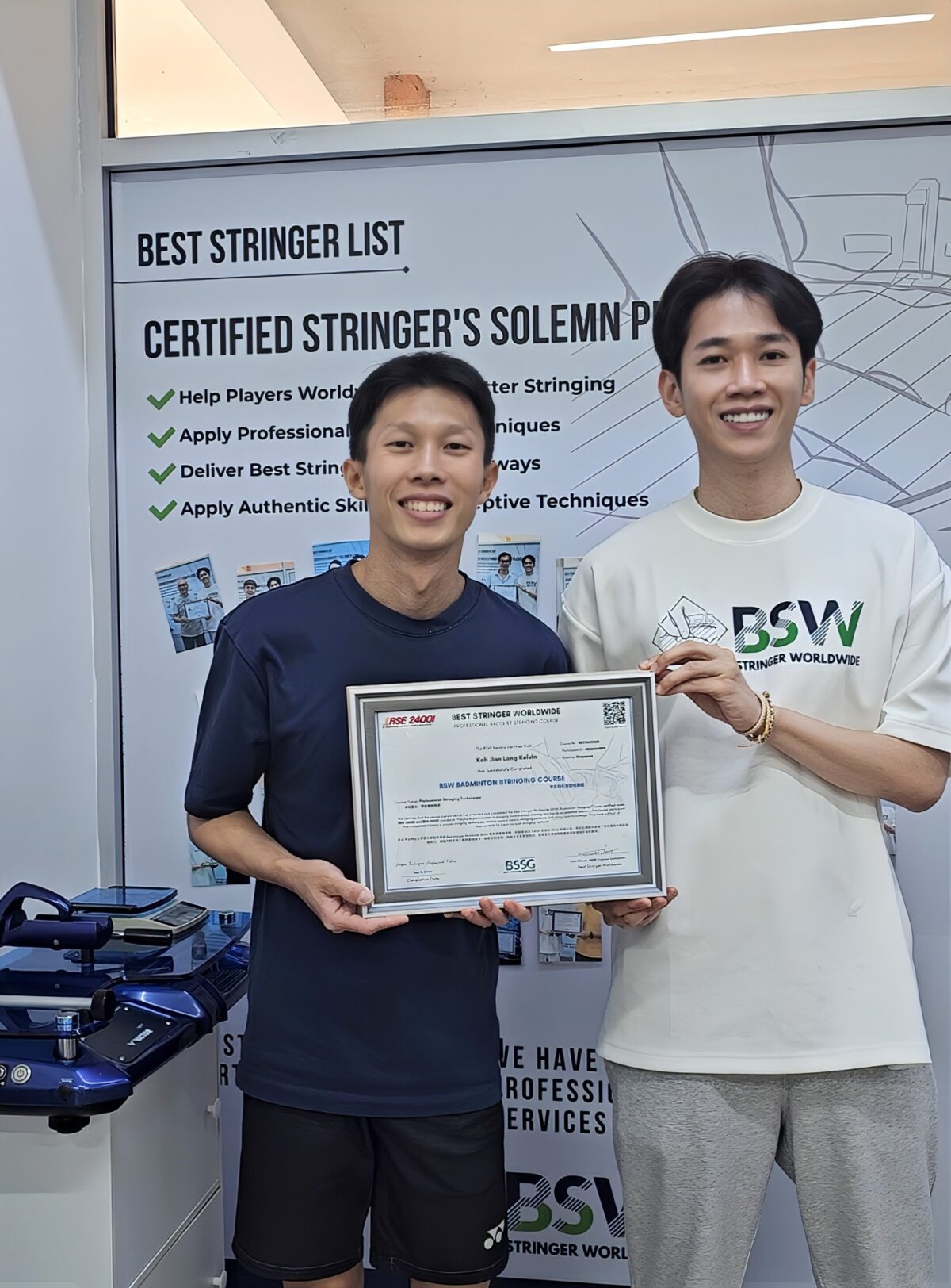 Koh Jian Long Kelvin, left, and Eric Chuar holding Kelvin's BSW badminton stringing course completion certificate Koh Jian Long Kelvin, left, and Eric Chuar holding Kelvin's BSW badminton stringing course completion certificate